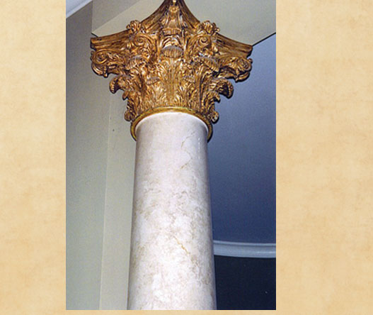 Gilded capital and faux column